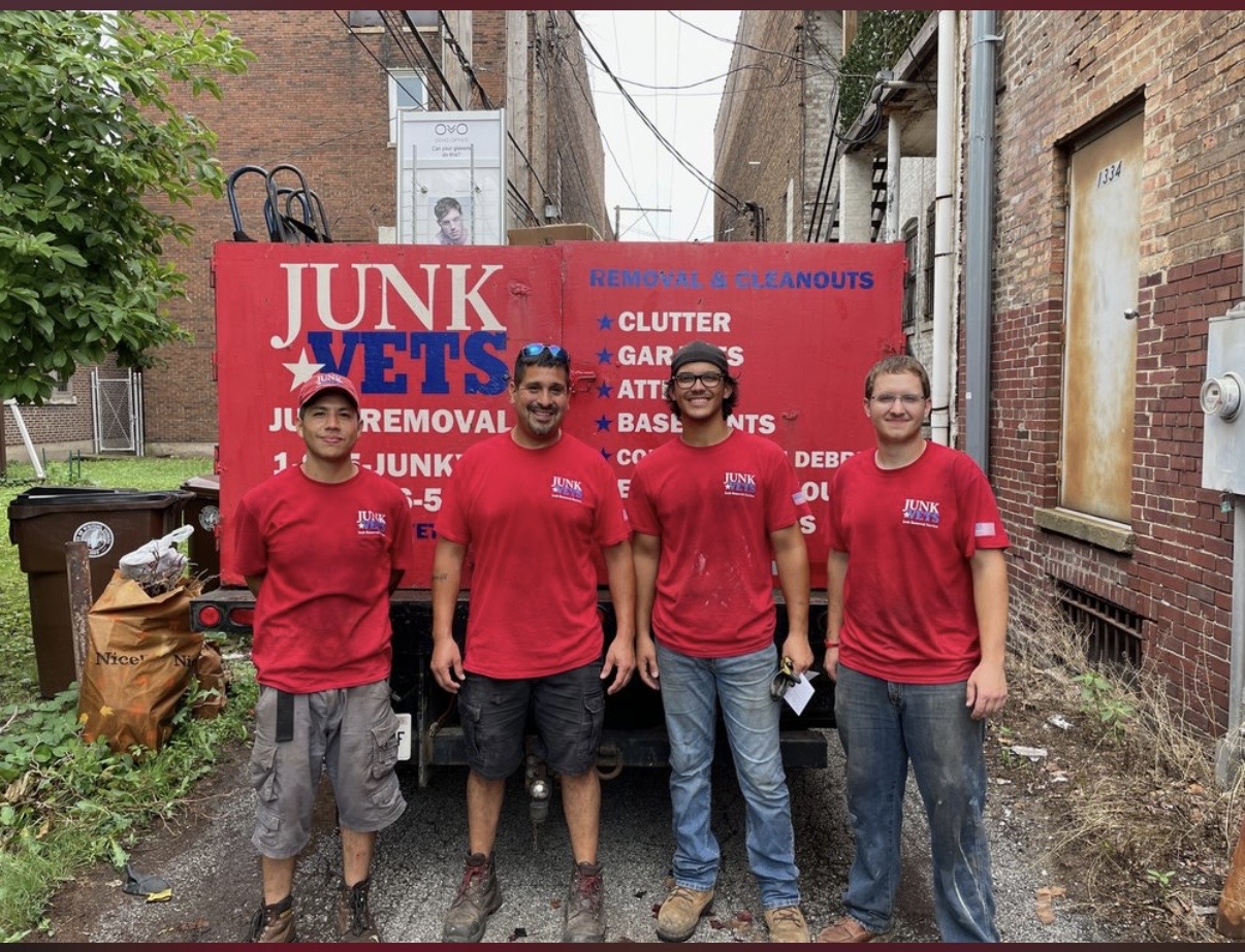 Hector Caballero and the JunkVets team in front of their truck